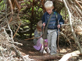 Oliver and Amy find a wooden house to play in on the way down from Creag Chonnich on our recent Scottish holiday.