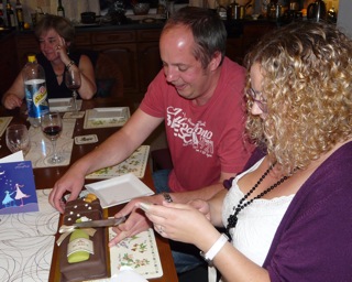 Ed cuts the cake, with his fiancee Jenny taking a keen interest, and Dot in the background