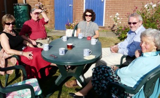 Dot, Mick Stedman, Anne Robinson, Philip Robinson and Gill Stedman drinking tea at Poringland