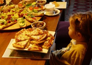 Another picture from Lisa's party, with daughter Blossom bemused by her large portion of pizza. Or more accurately, the large plate of pizza that had inadvertently been placed in front of her.