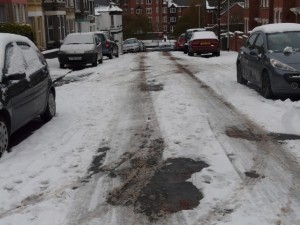 Aspland Road after the true grit treatment. Car in drive, stage left.