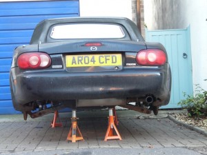 Dot's car looking vulnerable without its wheels