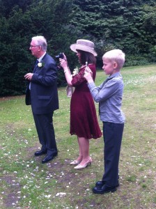 Rodney, Angela and Oliver line up for pictures at the wedding