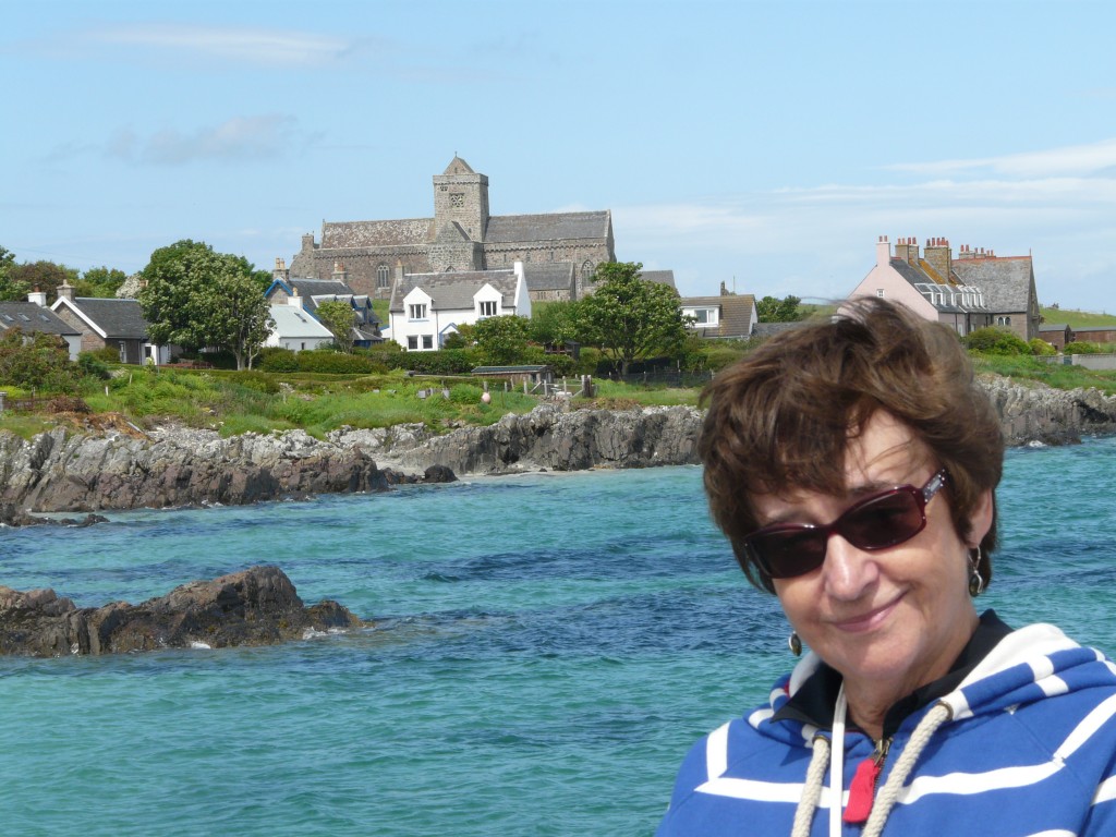 Dot, with our holiday home, Erraid House, in the background and the abbey (deceptively close) behind.