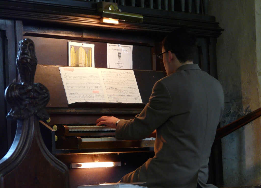 Organ recital at Paston Church, with just a hint of medieval wall painting in the background (right). 