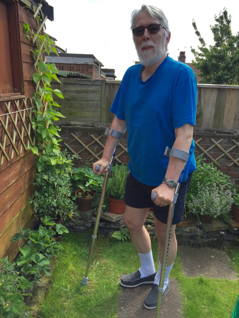 Phil in his back garden, recovering from his spine operation.