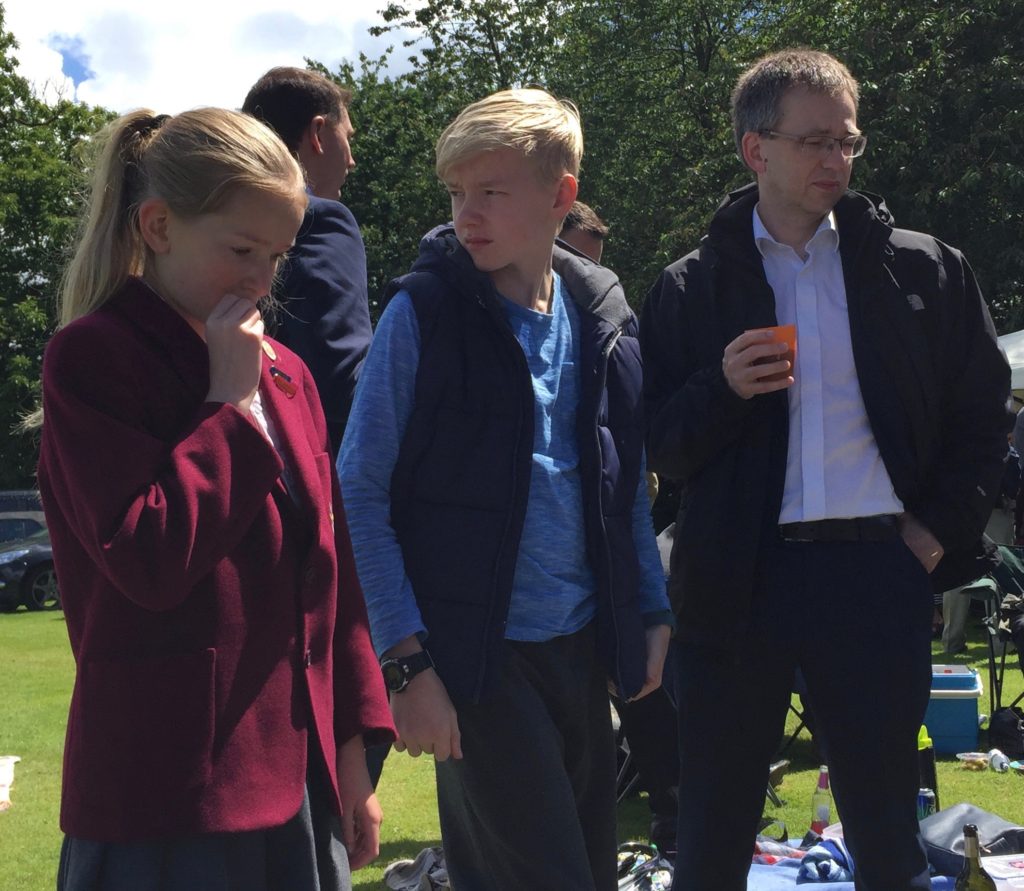 Amy, Oliver and David in thoughtful mood at the picnic.