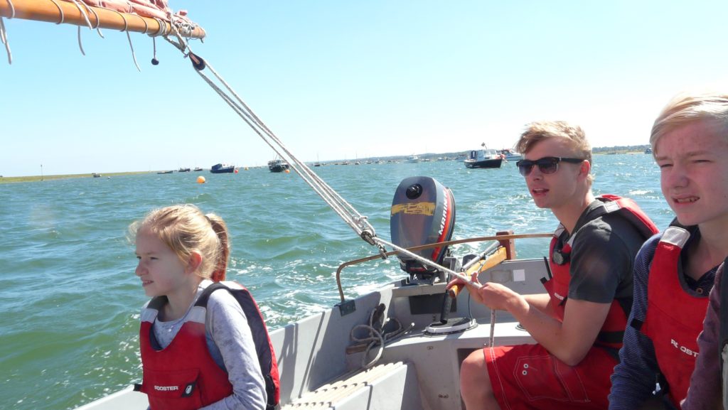 Amy all at sea with Jali (our captain) and Oliver, heading gout towards the seals