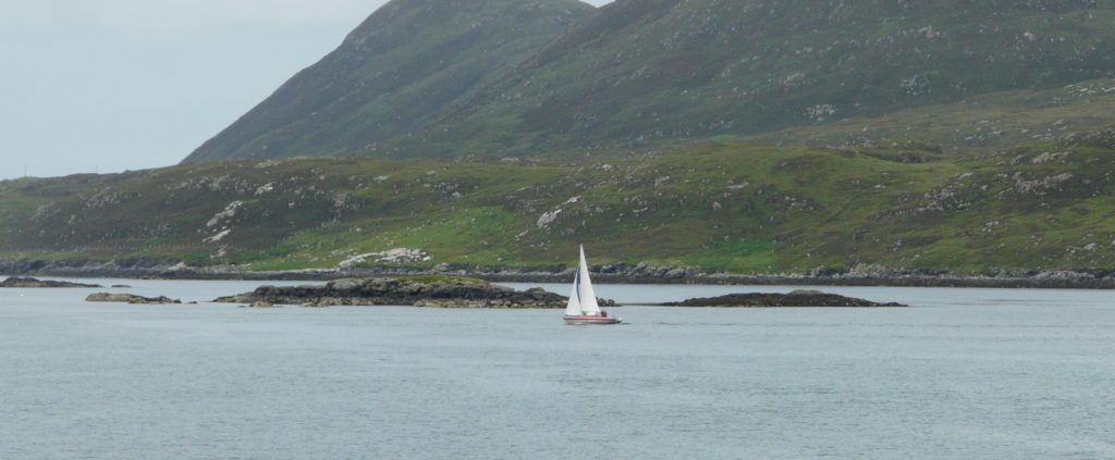 I've been going through the Scottish pictures, editing and titling. This was taken as our ferry approached Harris.