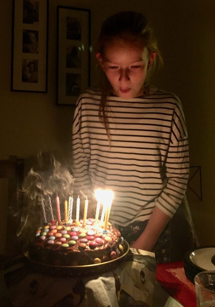 Amy blows out her candles.