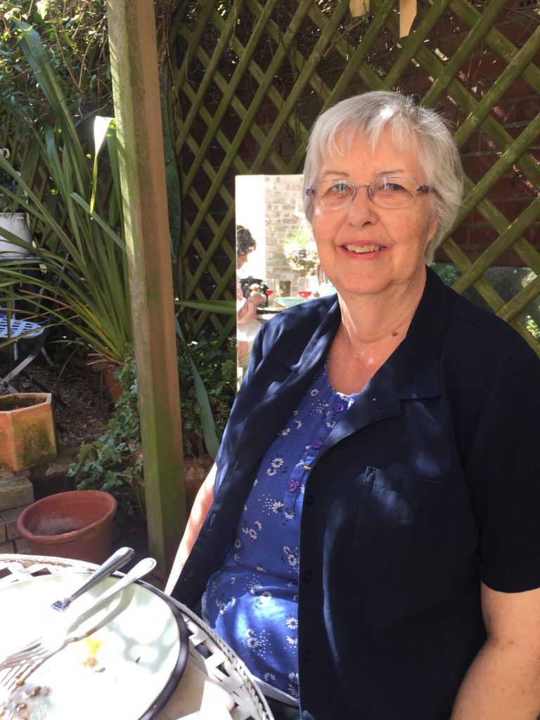 First wife Jennie C eating lunch in our garden. Yes, it was that warm.