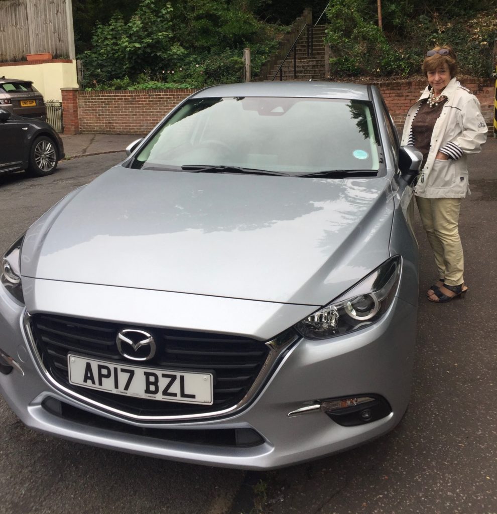 Dot with our new car, Mazda 3.