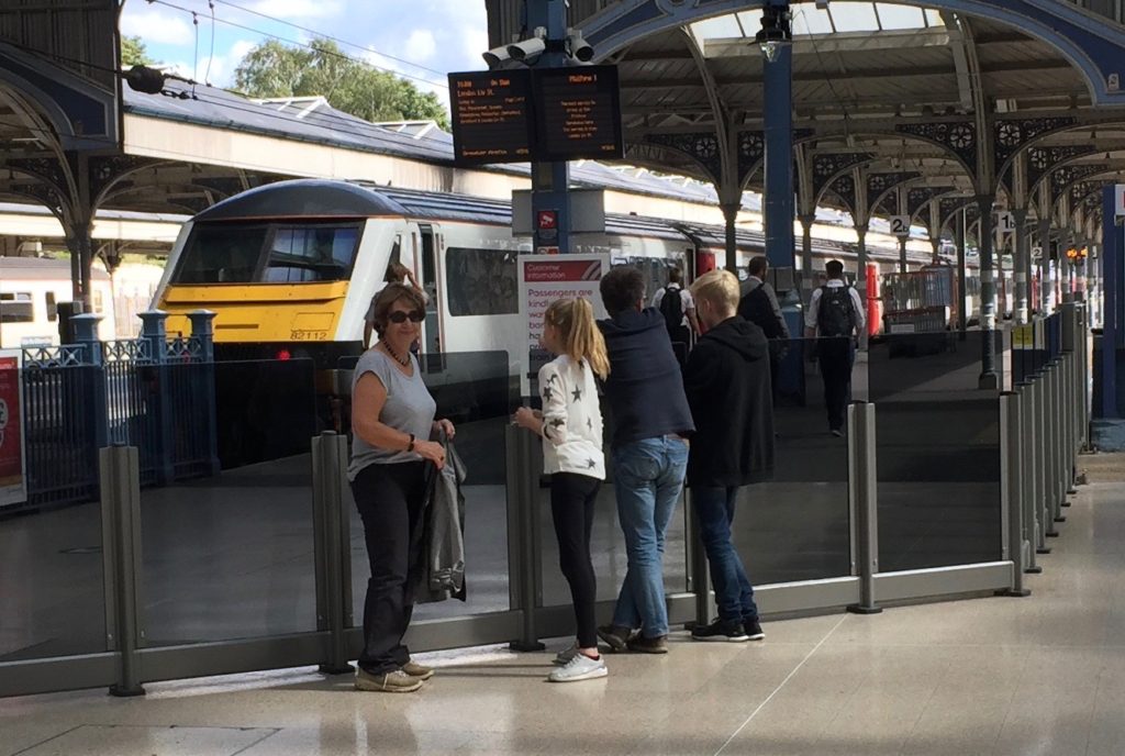 Dot, Amy, David and Oliver at Norwich station as the Murrays' train pulls in.